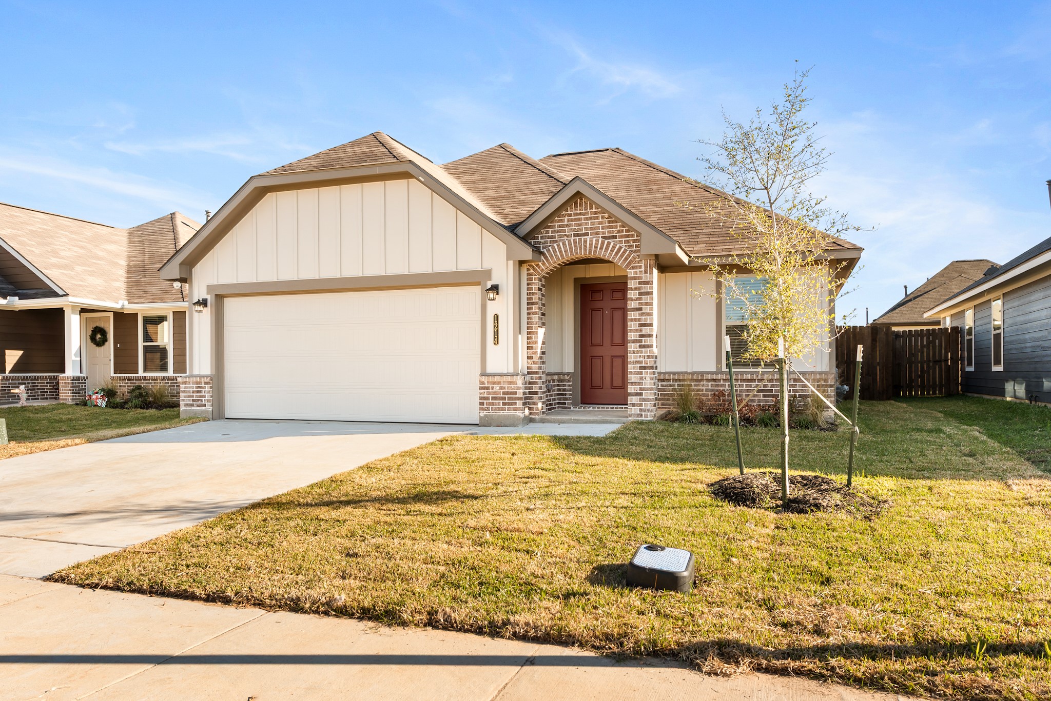 1214 High Street Navasota, TX 77868 - Photo 3 of 28 a front view of a house with a yard