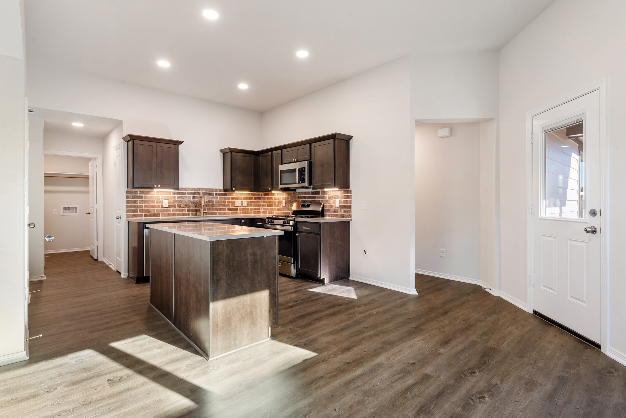 1214 High Street Navasota, TX 77868 - Photo 9 of 28 a kitchen with stove cabinets and refrigerator