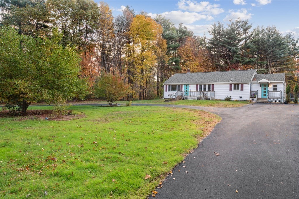 39 Duval Road Sutton, MA 01590 - Photo 1 of 24 a view of street with houses and trees in the background