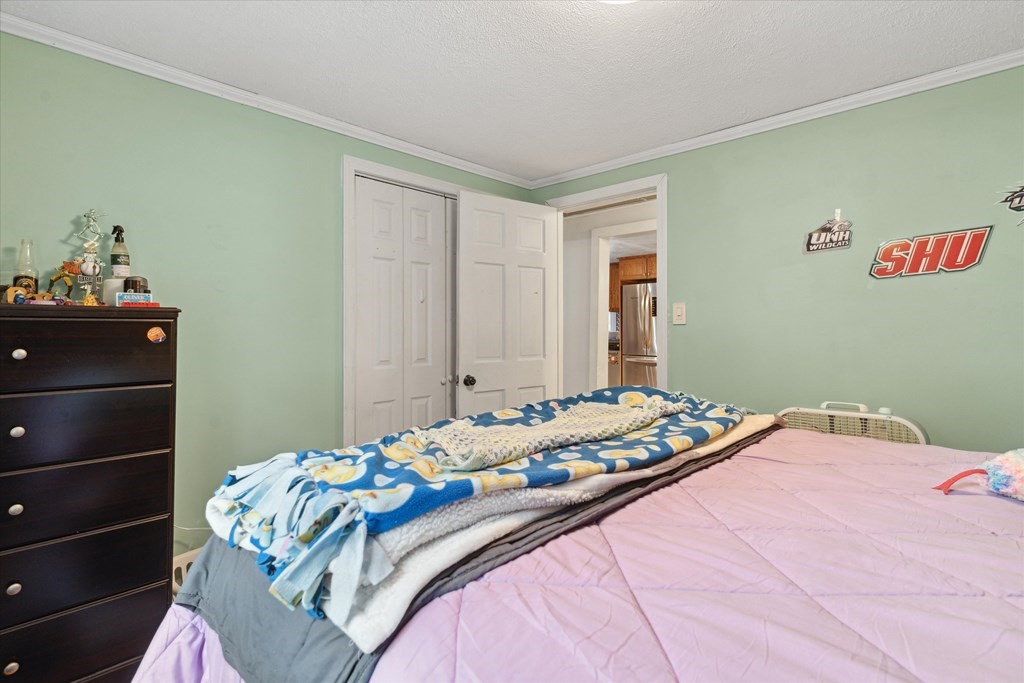 39 Duval Road Sutton, MA 01590 - Photo 15 of 24 a bedroom with a bed and a window