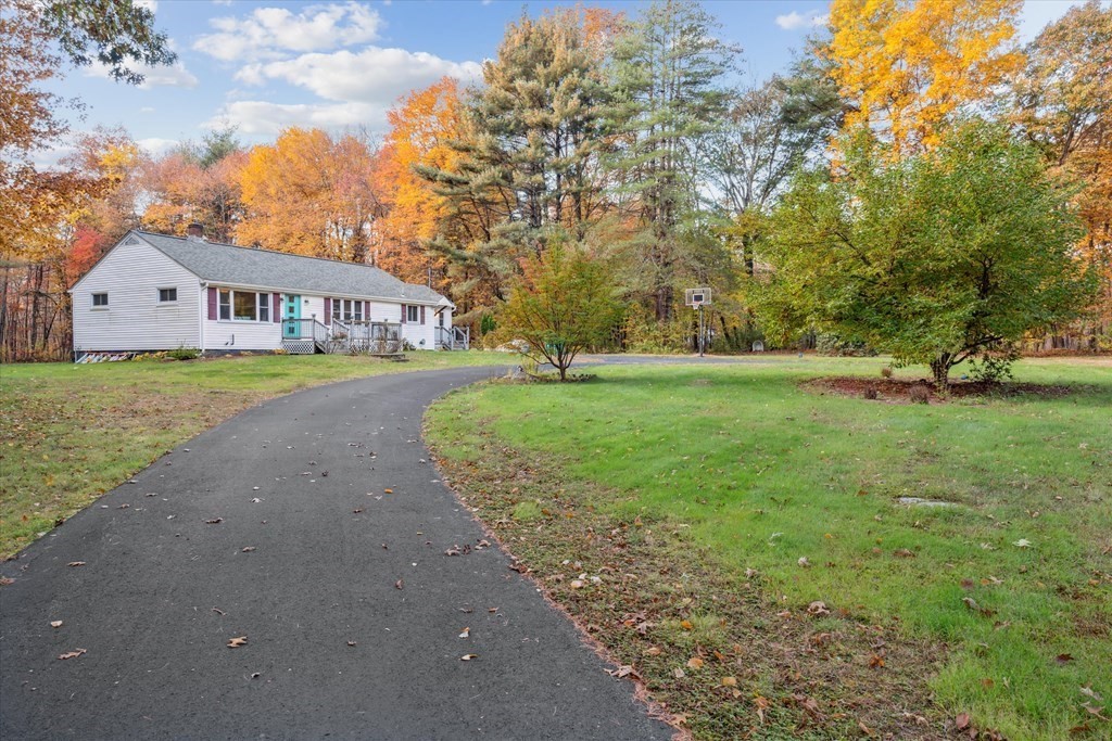 39 Duval Road Sutton, MA 01590 - Photo 3 of 24 a front view of a house with garden