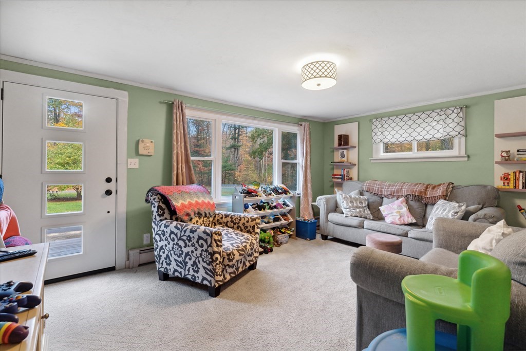 39 Duval Road Sutton, MA 01590 - Photo 4 of 24 a living room with furniture and a large window