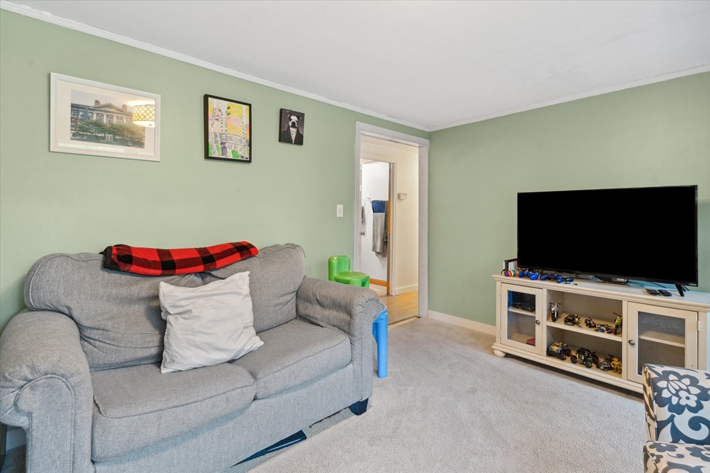 39 Duval Road Sutton, MA 01590 - Photo 5 of 24 a living room with furniture and a flat screen tv