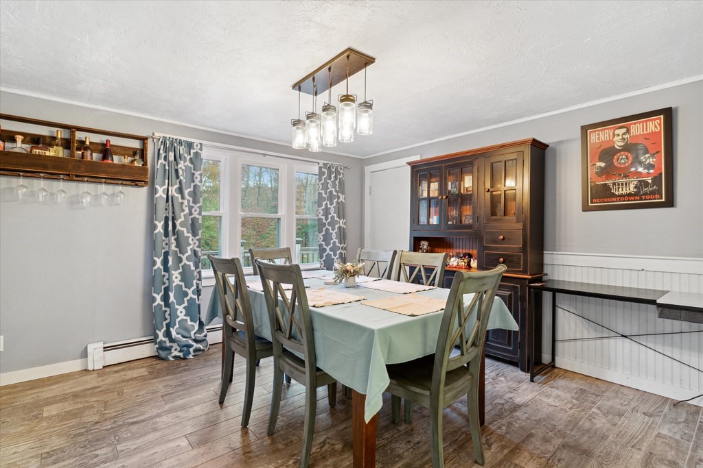 39 Duval Road Sutton, MA 01590 - Photo 6 of 24 a view of a dining room with furniture window and wooden floor