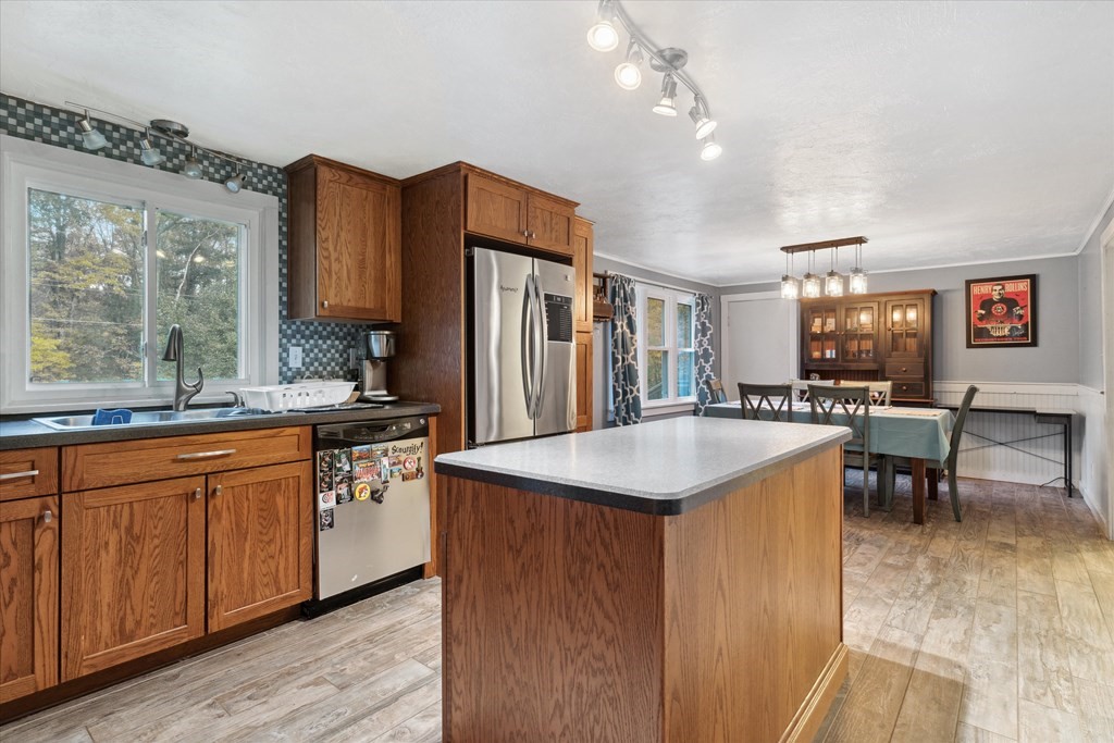 39 Duval Road Sutton, MA 01590 - Photo 9 of 24 a kitchen with stainless steel appliances granite countertop a sink stove and refrigerator