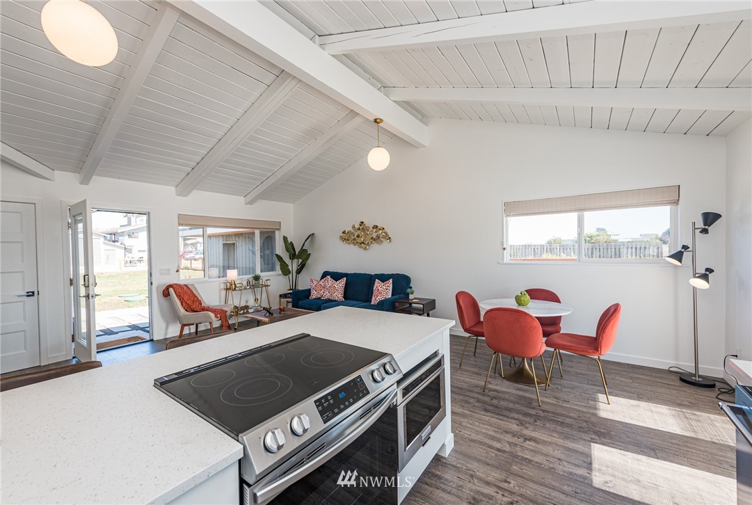 271 3 Crabs Road Sequim, WA 98382 - Photo 11 of 40 a bed room with a bed and a chair