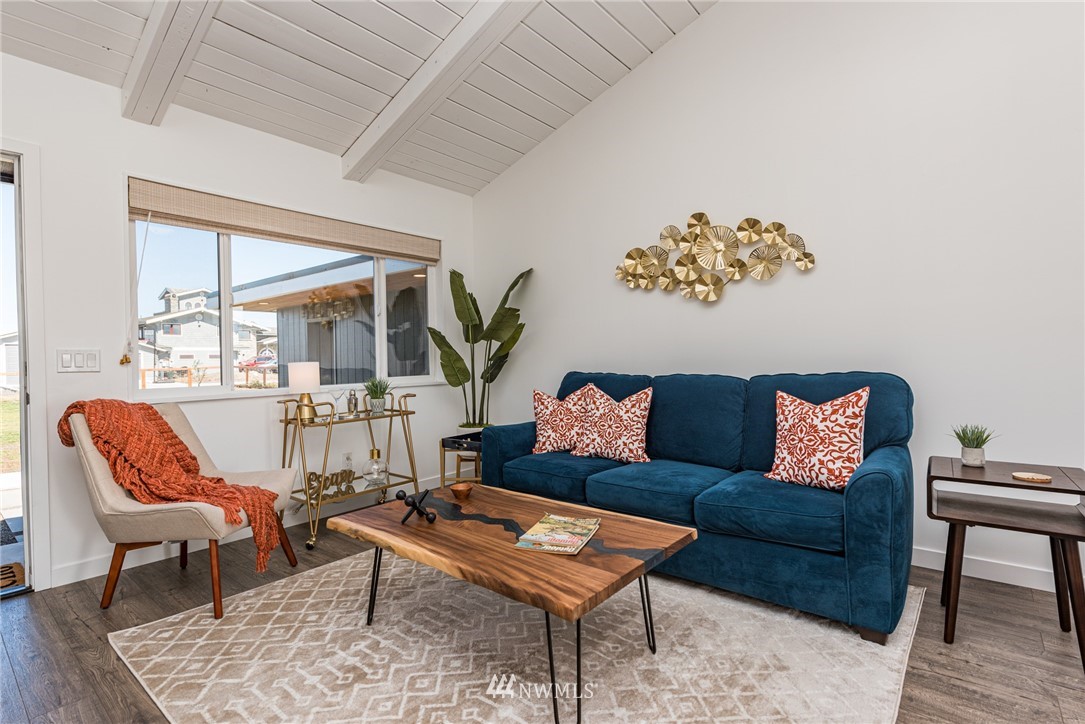 271 3 Crabs Road Sequim, WA 98382 - Photo 13 of 40 a living room with furniture and a large window