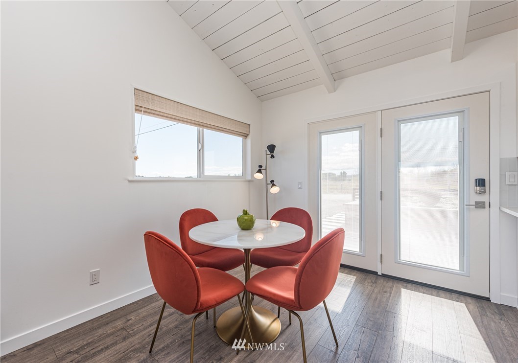 271 3 Crabs Road Sequim, WA 98382 - Photo 14 of 40 a dining room with furniture and wooden floor