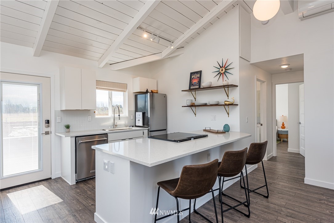 271 3 Crabs Road Sequim, WA 98382 - Photo 8 of 40 a kitchen with stainless steel appliances a sink and stove