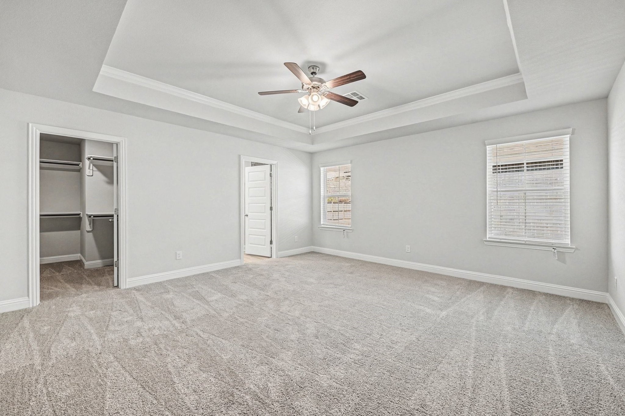 601 Greystone Lane Angleton, TX 77515 - Photo 17 of 32 an empty room with windows and fan