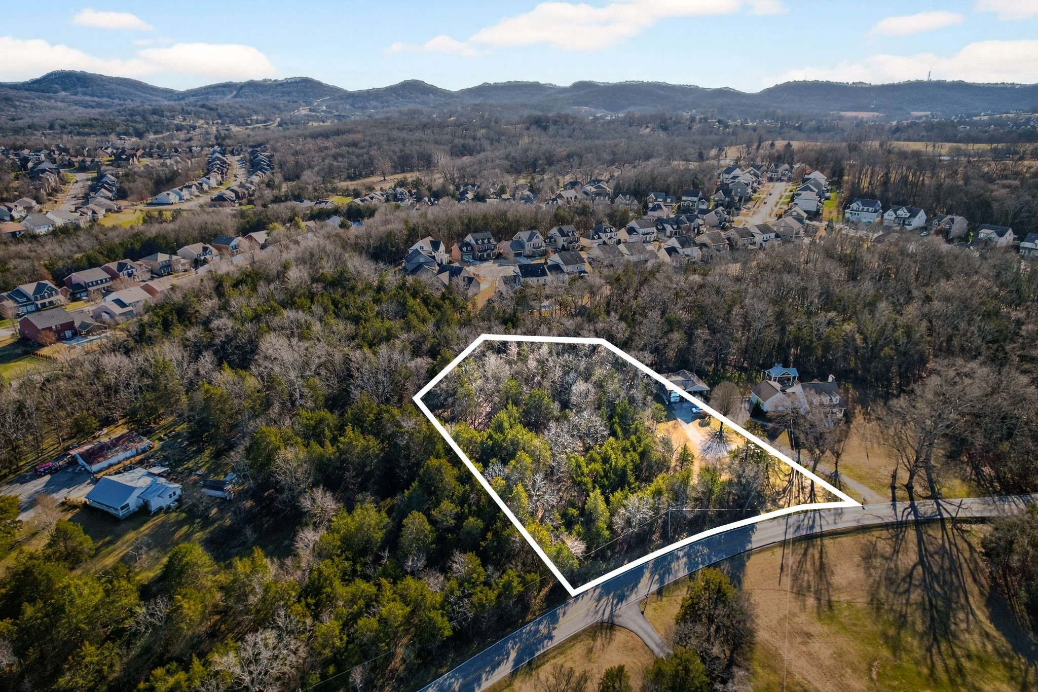 9877 Sam Donald Road Nolensville, TN 37135 - Photo 1 of 37 an aerial view of valley and residential houses