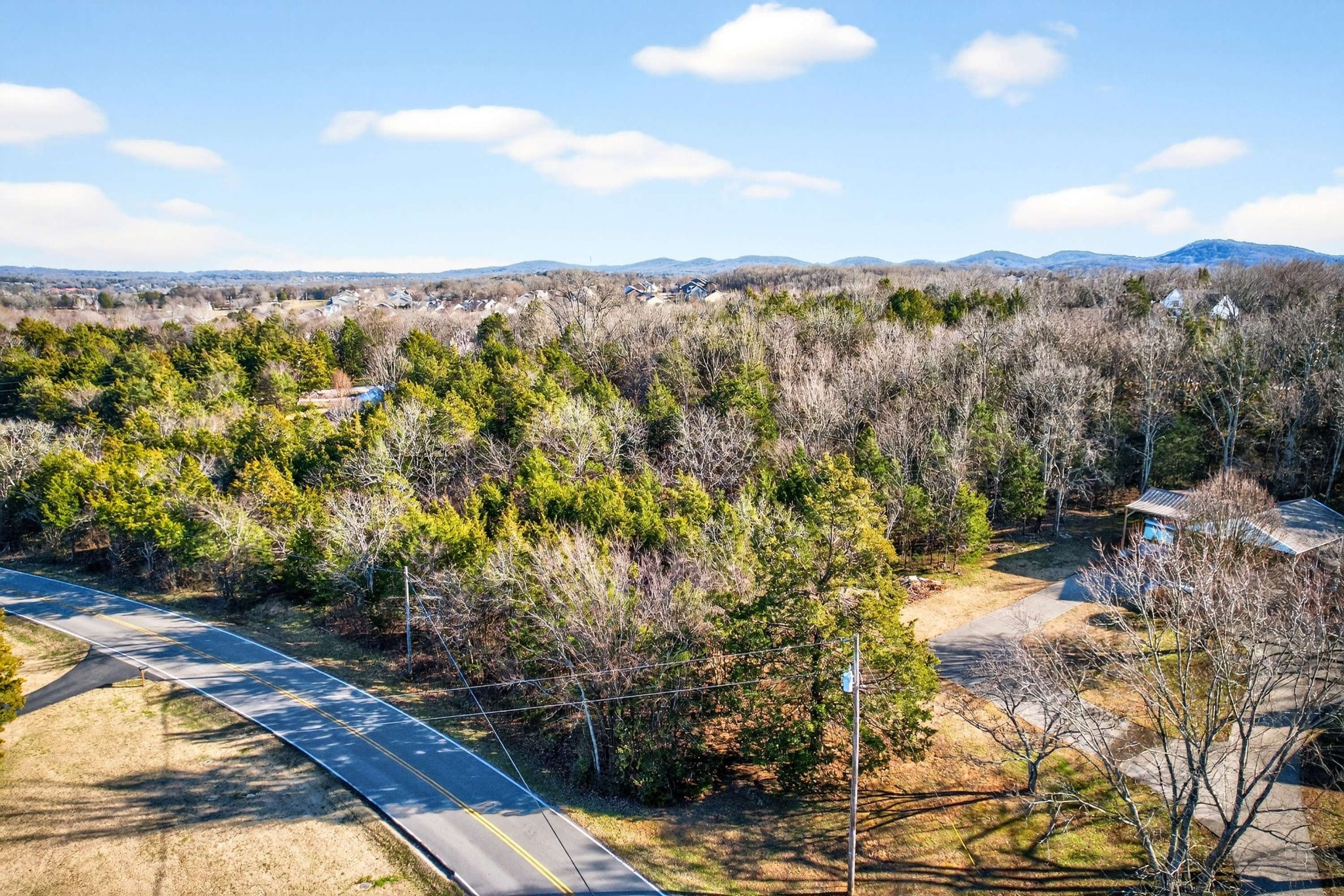 9877 Sam Donald Road Nolensville, TN 37135 - Photo 13 of 37 a view of a lake with mountains in the background
