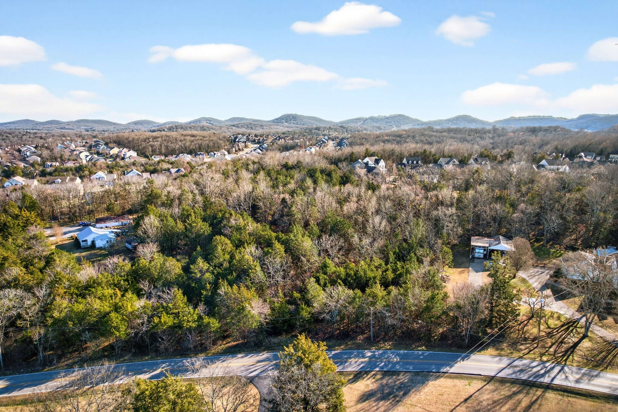 9877 Sam Donald Road Nolensville, TN 37135 - Photo 25 of 37 a view of a city with mountains in the background