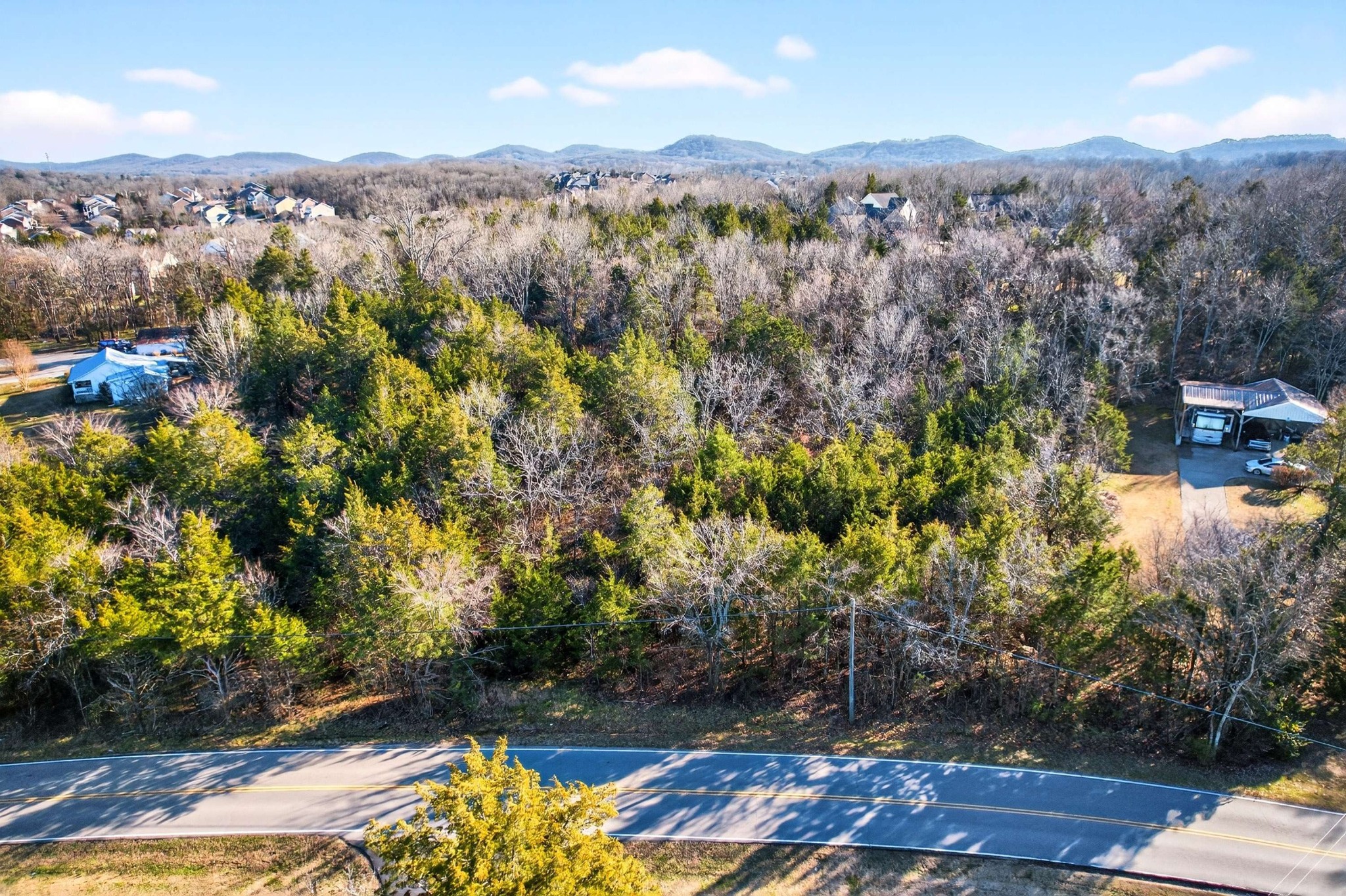 9877 Sam Donald Road Nolensville, TN 37135 - Photo 3 of 37 a view of a city with mountains in the background