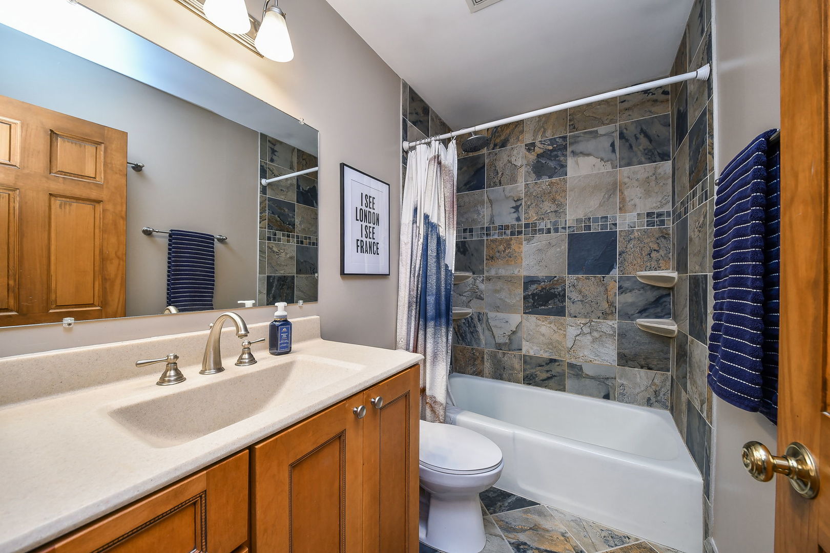 27W108 Walnut Drive Winfield, IL 60190 - Photo 14 of 20 a bathroom with a sink and a mirror