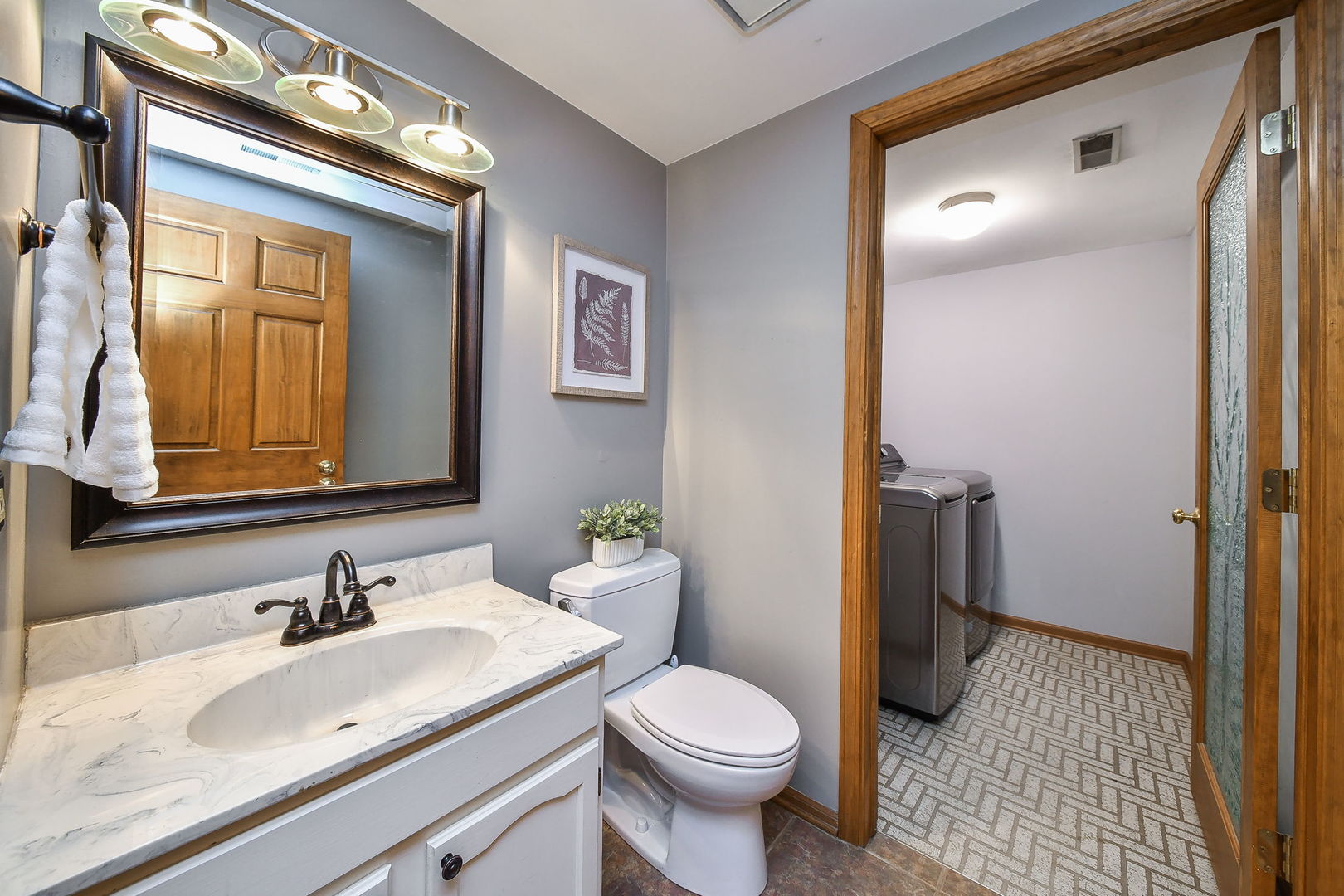 27W108 Walnut Drive Winfield, IL 60190 - Photo 7 of 20 a bathroom with a sink and a toilet