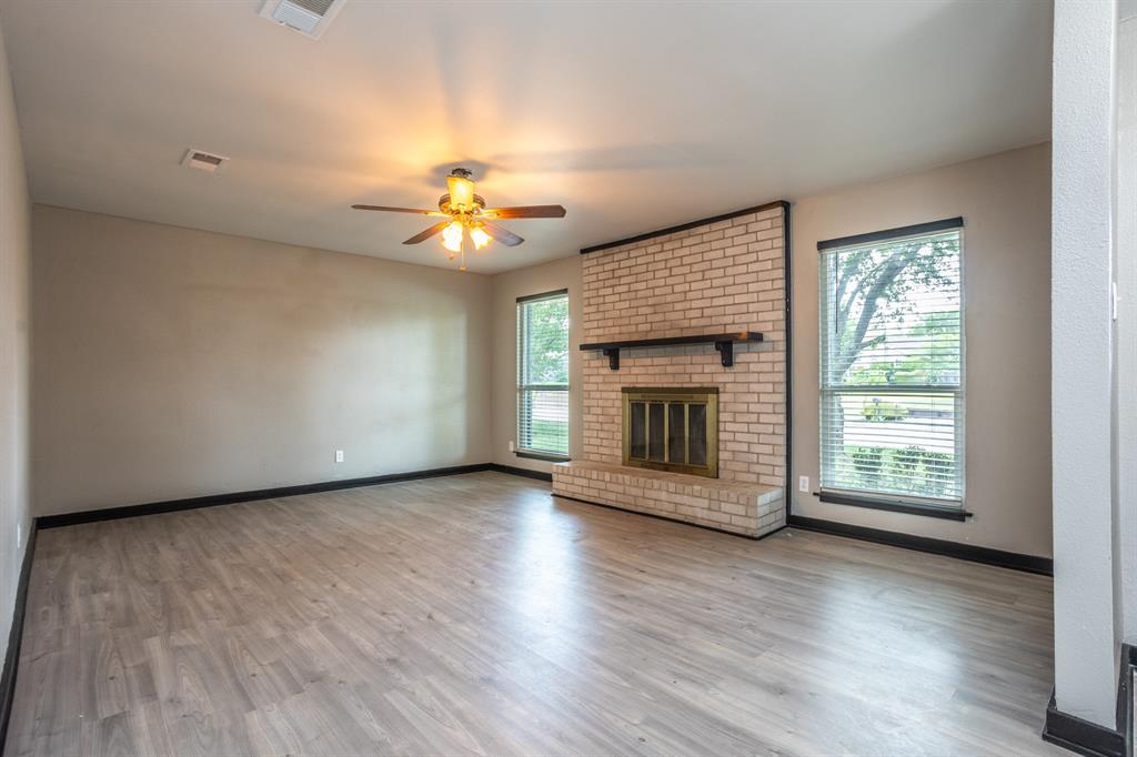 1206 Oakbluff Drive Lancaster, TX 75146 - Photo 4 of 23 Large living area with big windows to the front.