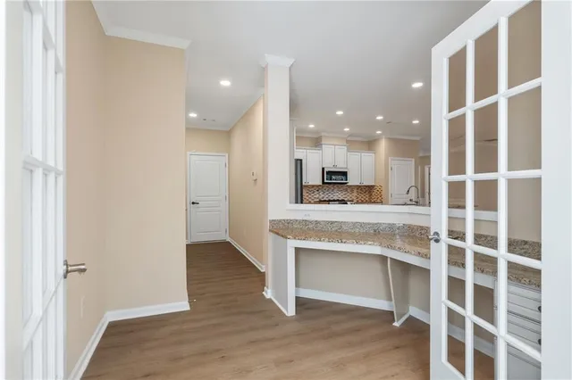 a view of kitchen with wooden floor and window