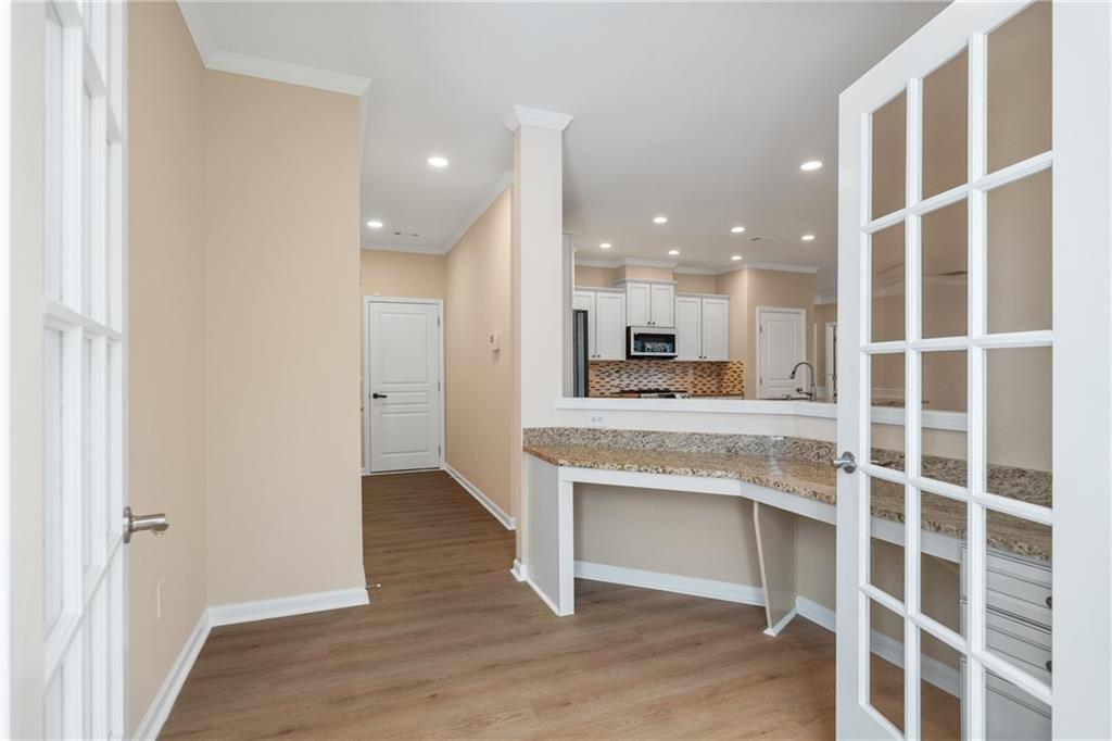 865 Great Glen Place Suwanee, GA 30024 - Photo 20 of 45 a view of kitchen with wooden floor and window