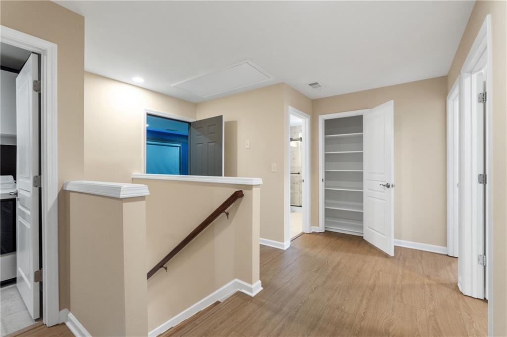 865 Great Glen Place Suwanee, GA 30024 - Photo 26 of 45 a view of kitchen and wooden floor