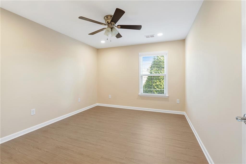 865 Great Glen Place Suwanee, GA 30024 - Photo 30 of 45 an empty room with a window
