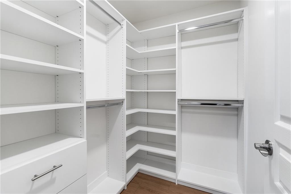 865 Great Glen Place Suwanee, GA 30024 - Photo 38 of 45 a view of walk in closet with empty racks
