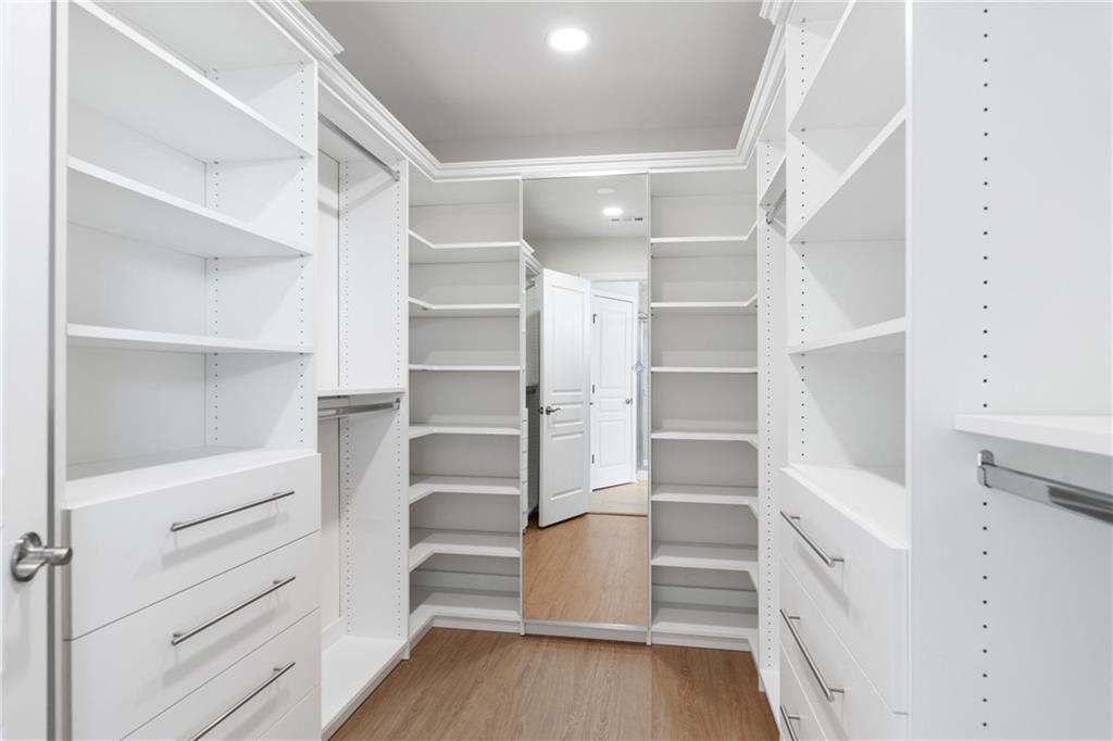 865 Great Glen Place Suwanee, GA 30024 - Photo 40 of 45 a view of walk in closet with empty racks