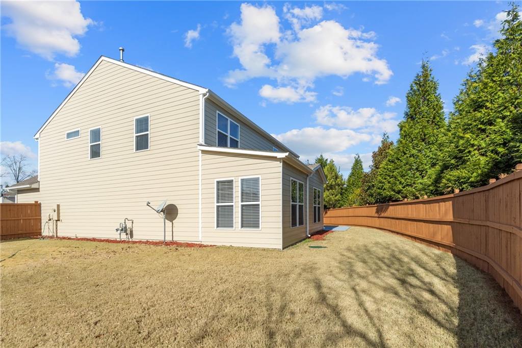 865 Great Glen Place Suwanee, GA 30024 - Photo 43 of 45 a view of a house with a wooden fence