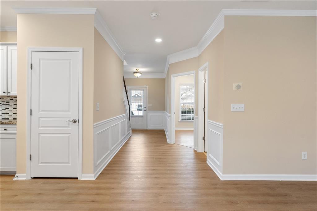 865 Great Glen Place Suwanee, GA 30024 - Photo 5 of 45 a view of a hallway with wooden floor