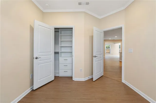 wooden floor and closet in a room