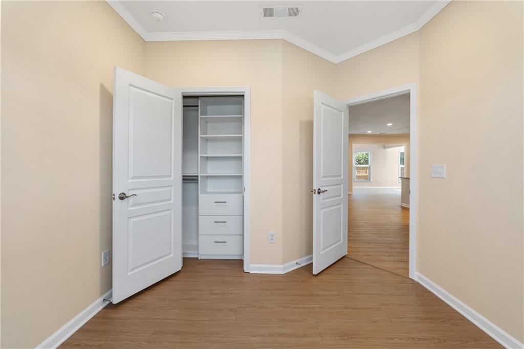865 Great Glen Place Suwanee, GA 30024 - Photo 7 of 45 wooden floor and closet in a room