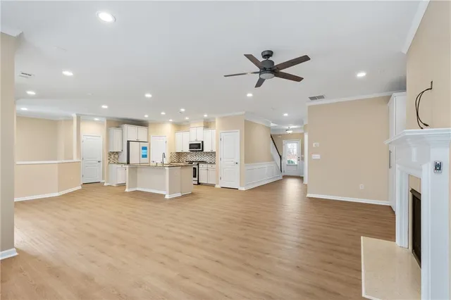 a view of an empty room with kitchen appliances