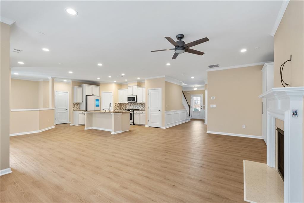 865 Great Glen Place Suwanee, GA 30024 - Photo 9 of 45 a view of an empty room with kitchen appliances