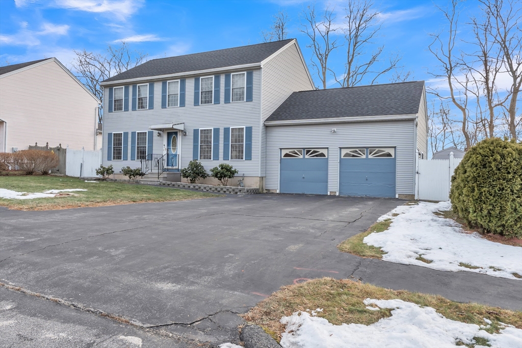 8 Modred Court Worcester, MA 01602 - Photo 1 of 28 a front view of a house with a yard and garage