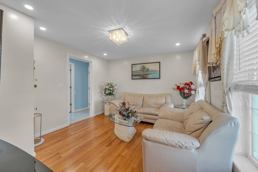 8 Modred Court Worcester, MA 01602 - Photo 12 of 28 a living room with furniture and flowers