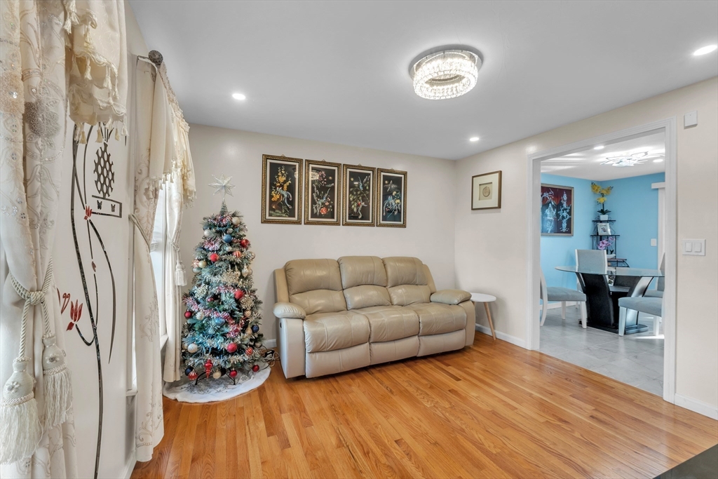 8 Modred Court Worcester, MA 01602 - Photo 13 of 28 a living room with furniture and a wooden floor