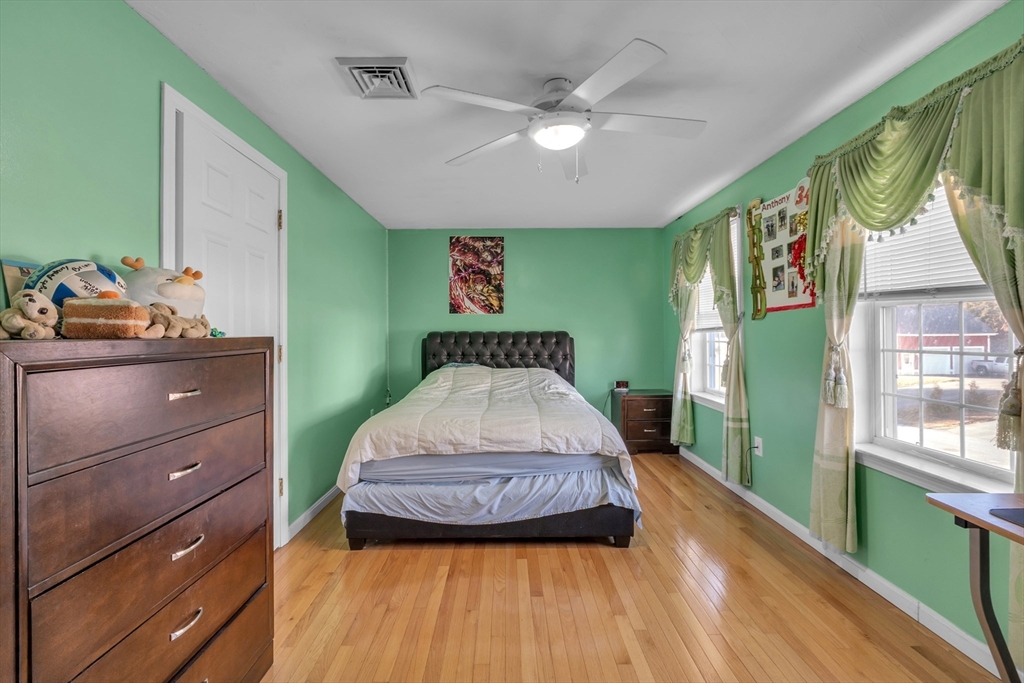8 Modred Court Worcester, MA 01602 - Photo 16 of 28 a spacious bedroom with a bed and a dresser