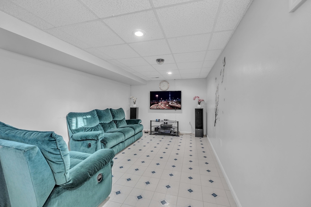 8 Modred Court Worcester, MA 01602 - Photo 20 of 28 a bedroom with furniture and a flat screen tv