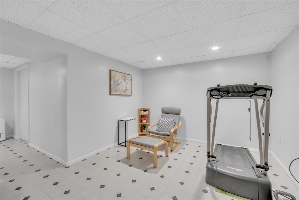 8 Modred Court Worcester, MA 01602 - Photo 21 of 28 a bedroom with a bed and a wooden floor