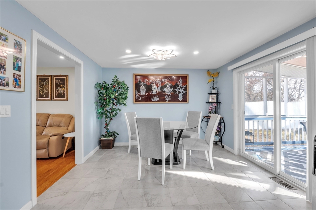 8 Modred Court Worcester, MA 01602 - Photo 9 of 28 a view of a livingroom with furniture and a floor to ceiling window