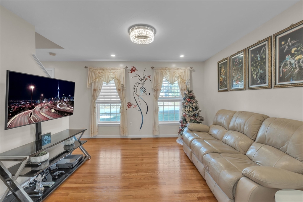 8 Modred Court Worcester, MA 01602 - Photo 10 of 28 a living room with furniture and a wooden floor