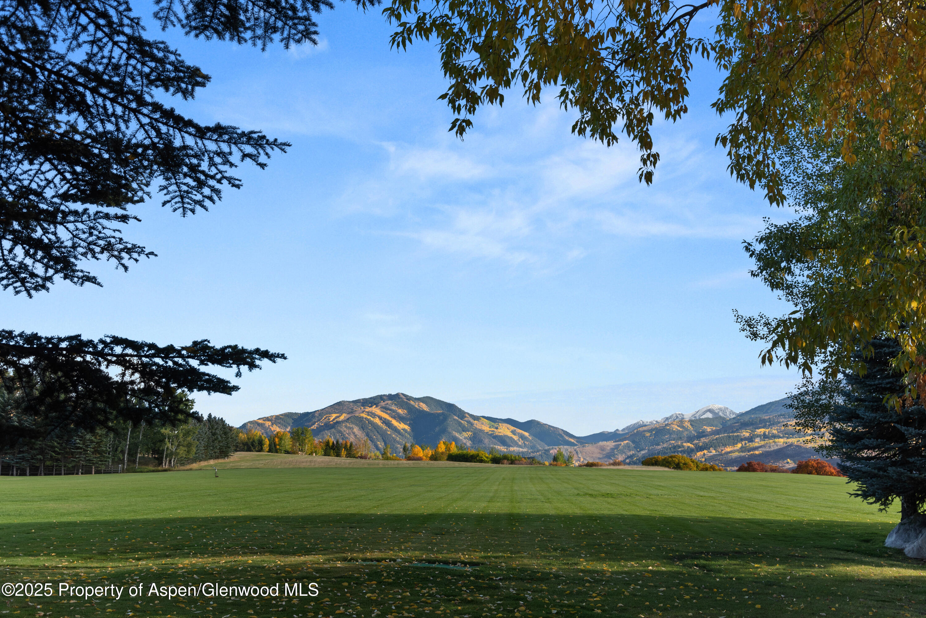 1650 McLain Flats Road Aspen, CO 81611 - Photo 19 of 72 a view of a golf course with a lake view