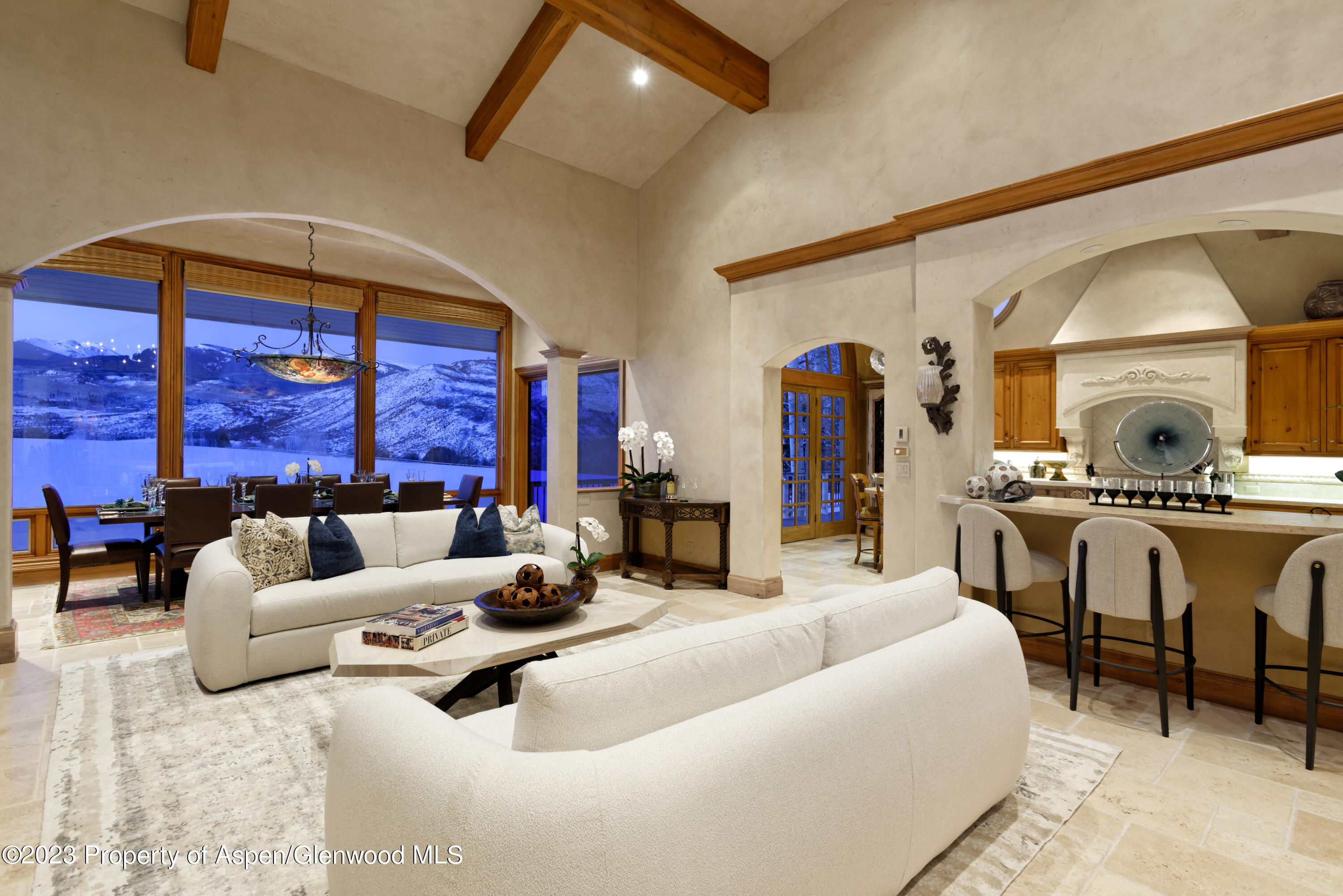 1650 McLain Flats Road Aspen, CO 81611 - Photo 28 of 72 a living room with furniture a fireplace and a flat screen tv