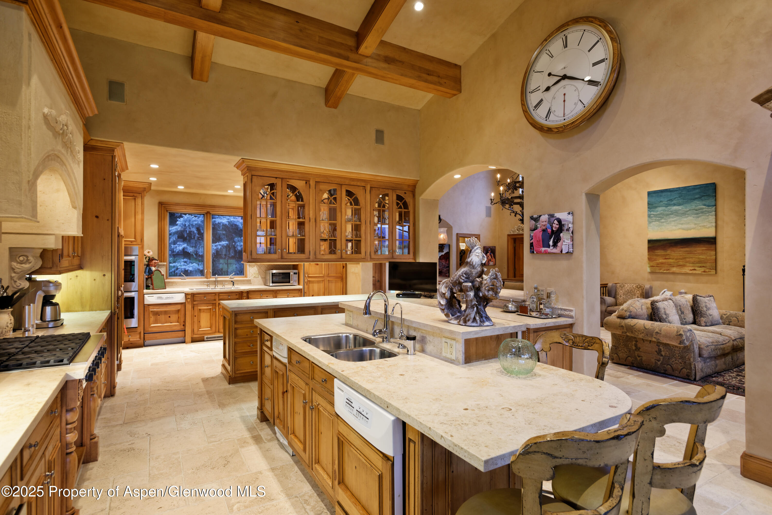 1650 McLain Flats Road Aspen, CO 81611 - Photo 30 of 72 a dining hall with stainless steel appliances kitchen island granite countertop a dining table and chairs