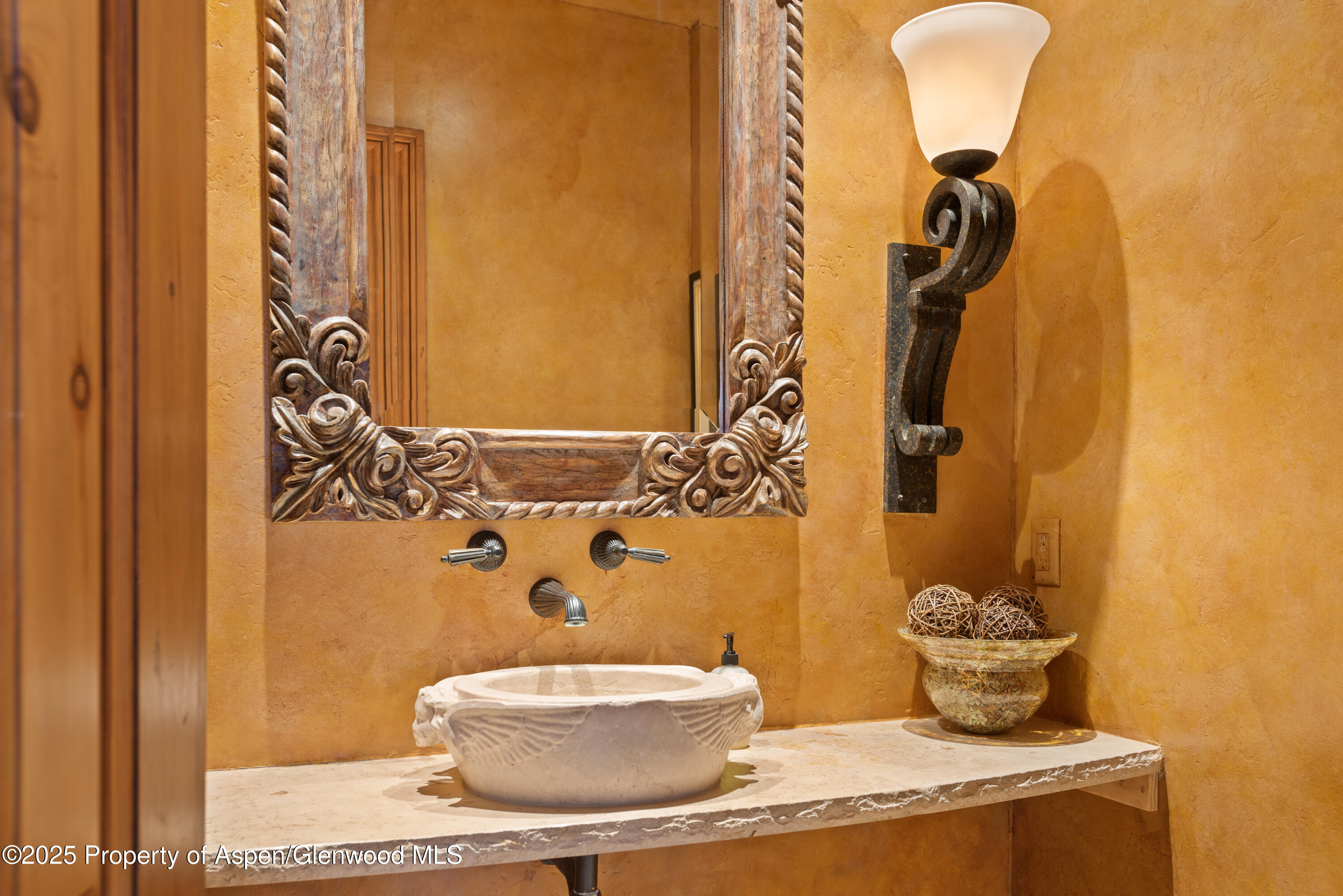 1650 McLain Flats Road Aspen, CO 81611 - Photo 34 of 72 a bathroom with a granite countertop sink and a mirror