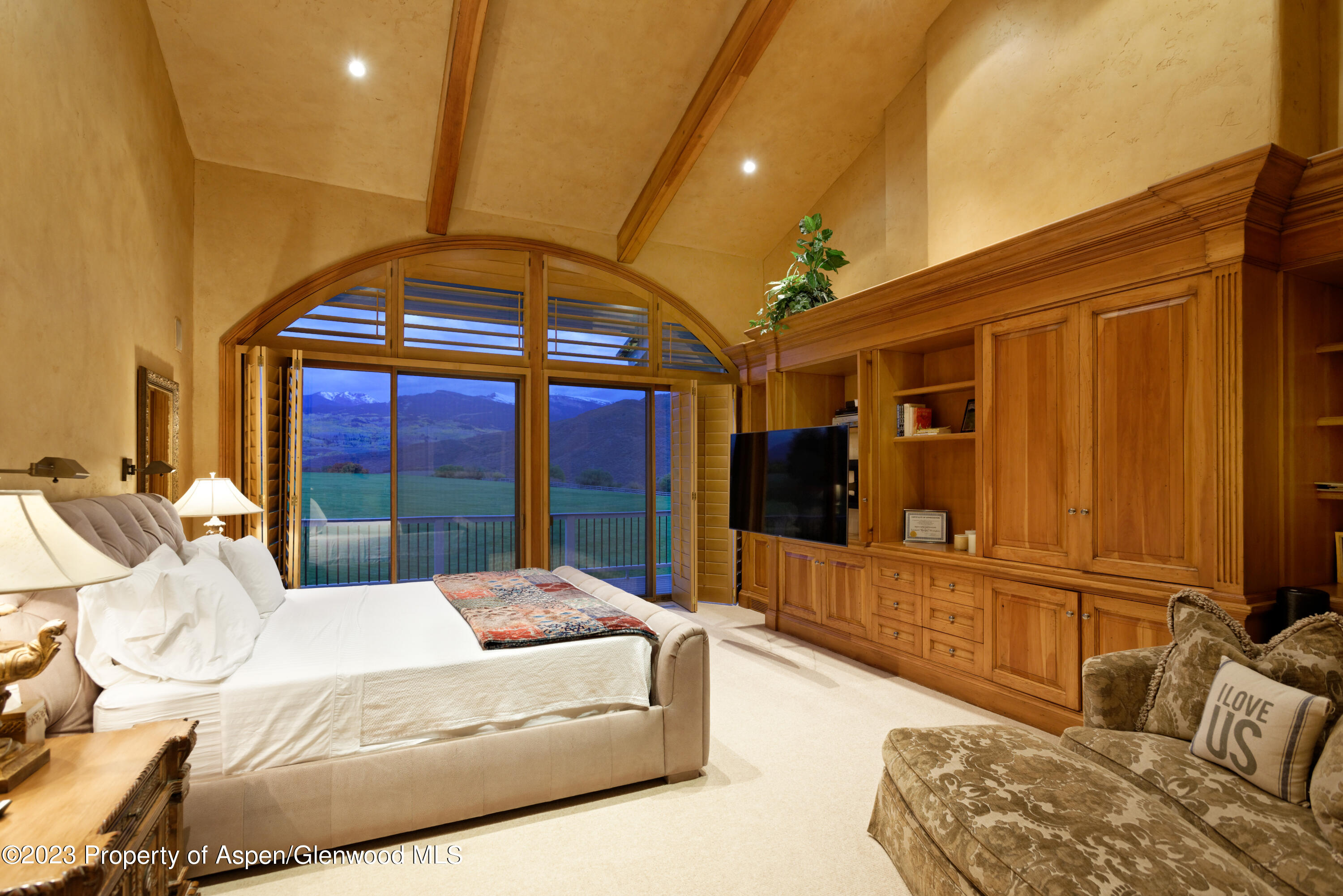 1650 McLain Flats Road Aspen, CO 81611 - Photo 36 of 72 a balcony with furniture and a chandelier