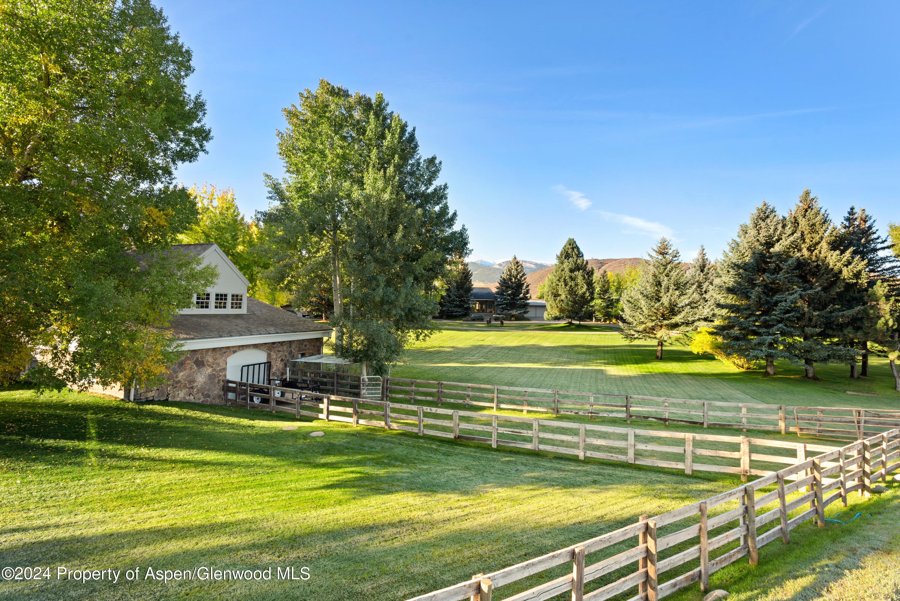 1650 McLain Flats Road Aspen, CO 81611 - Photo 7 of 72 a view of a swimming pool with an outdoor space and seating area