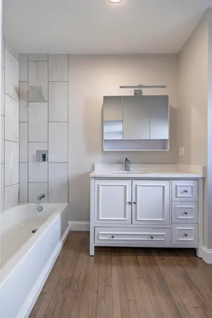 a utility room with sink dryer and washer
