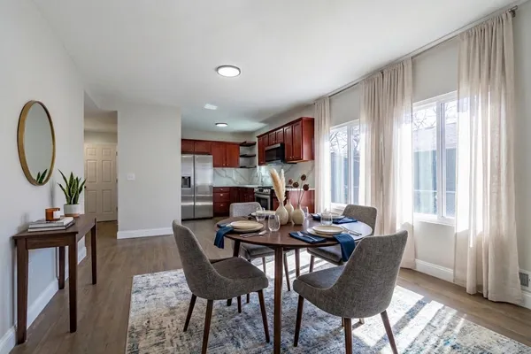 a dining room with furniture and window