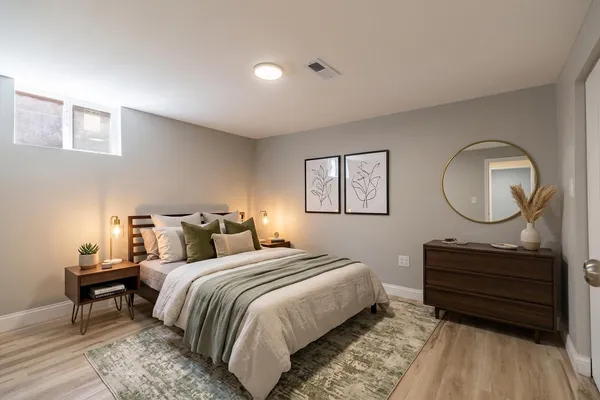 a bedroom with bed and a dresser